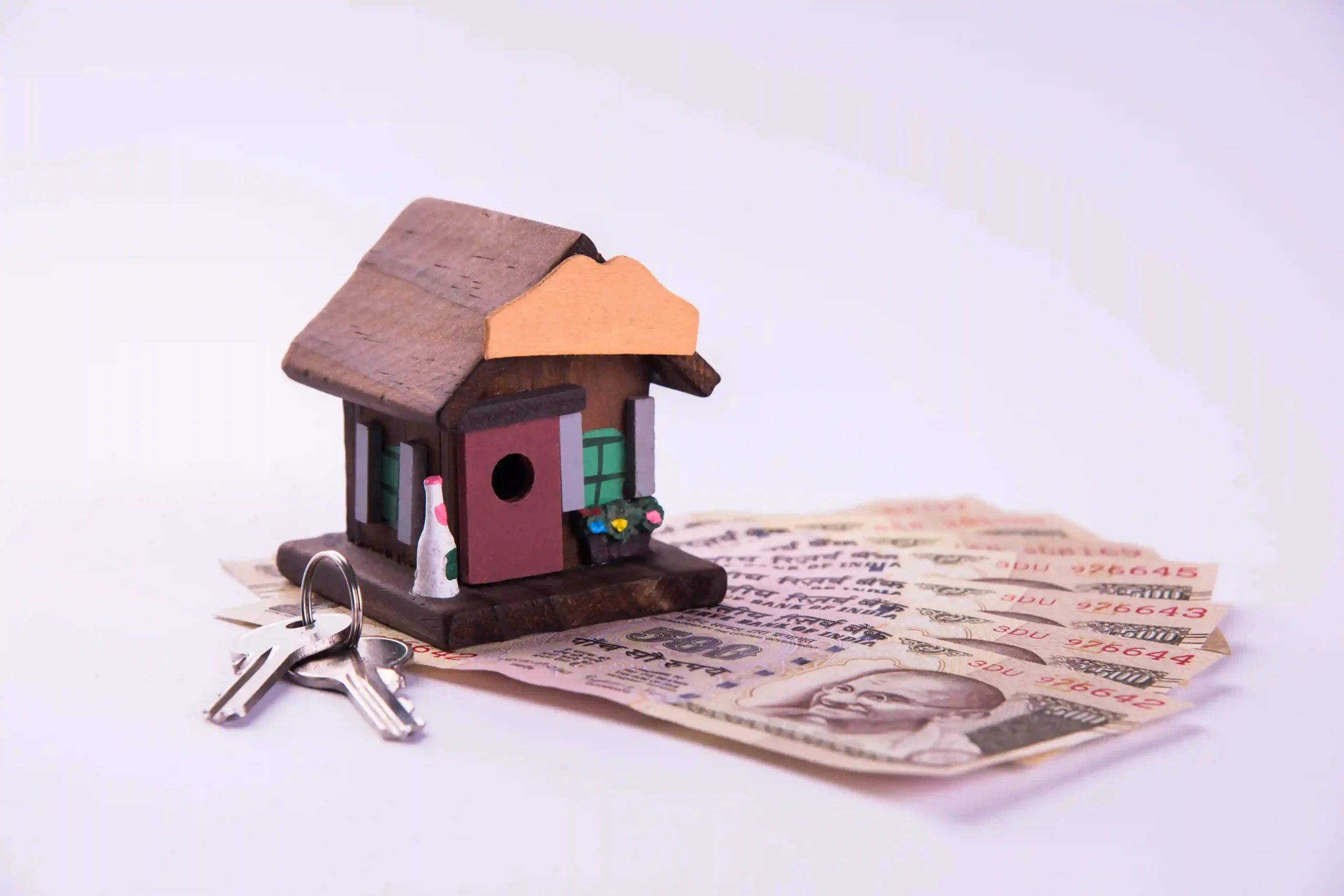 finance-housing-loan-purchase-india-concept-showing-3d-house-model-indian-currency-notes-calculator-etc (1)_11zon